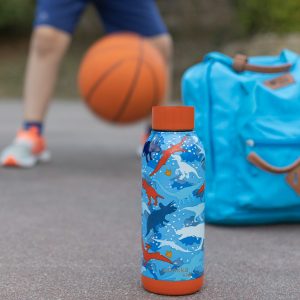 blue and white plastic bottle beside orange basketball on gray concrete floor during daytime